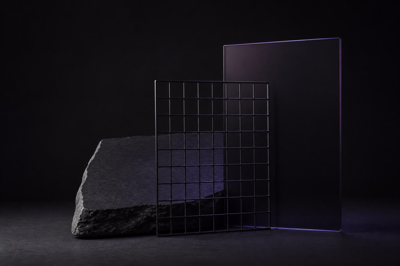Abstract study of stone, a wire grid, and smoked glass.
